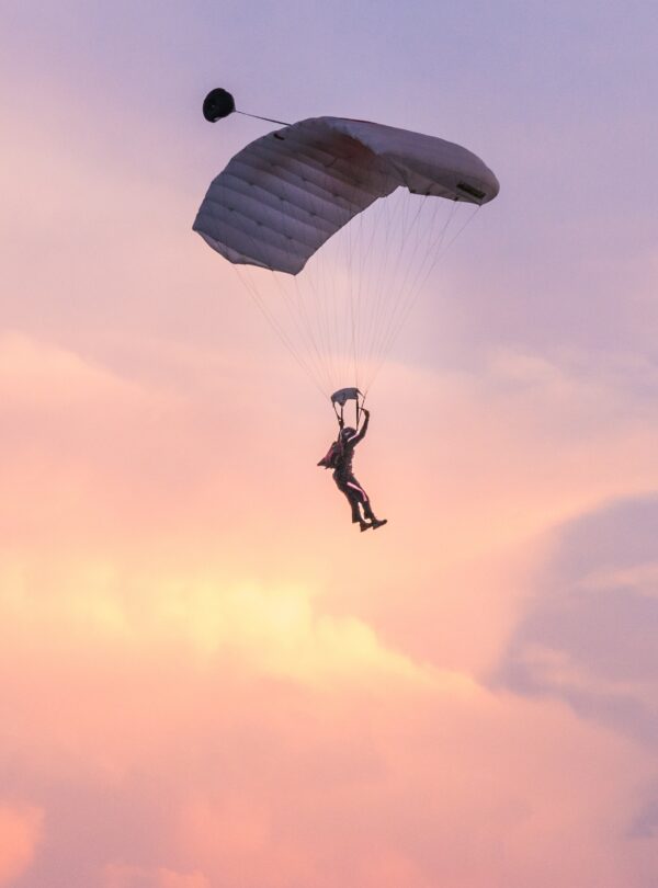 skydiver silhouetted against a pink and purple sky 2026 01 05 01 13 21 utc